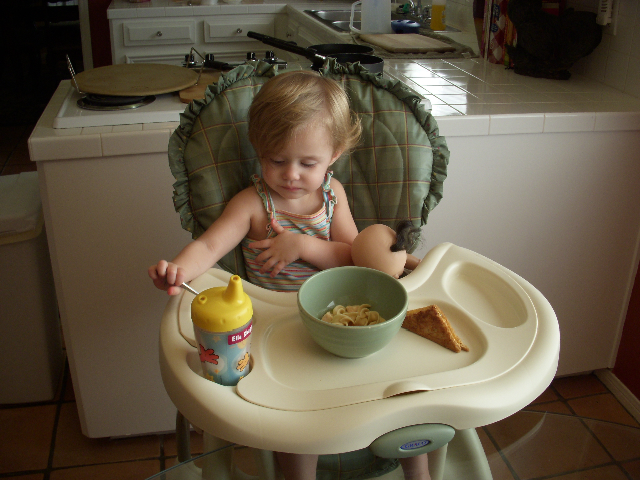 Ella eats with her baby